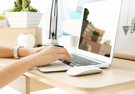 Woman working on laptop at home